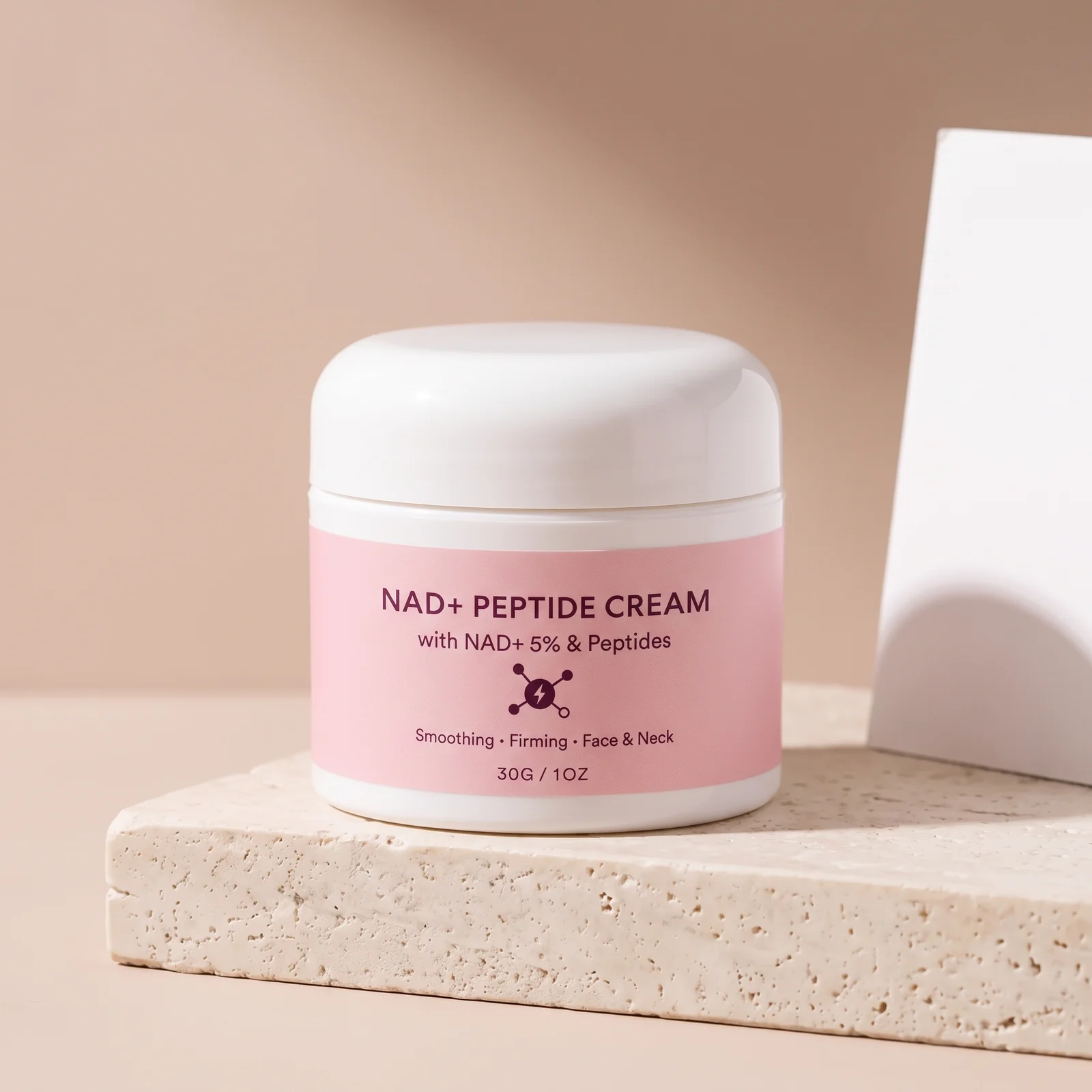 Nadora NAD+ Peptide Cream jar, lid off, on a stone bathroom shelf in morning light